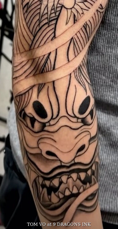 Horned Japanese mask tattoo by Tom Vo at 9 Dragons Ink in San Jose
