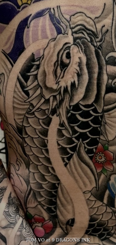 Koi and floral tattoo detail by Tom Vo at 9 Dragons Ink in San Jose
