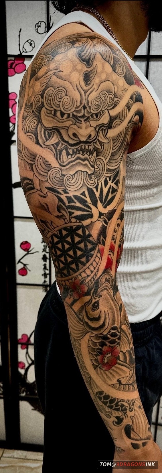 Mask and koi sleeve tattoo by Tom at 9 Dragons Ink