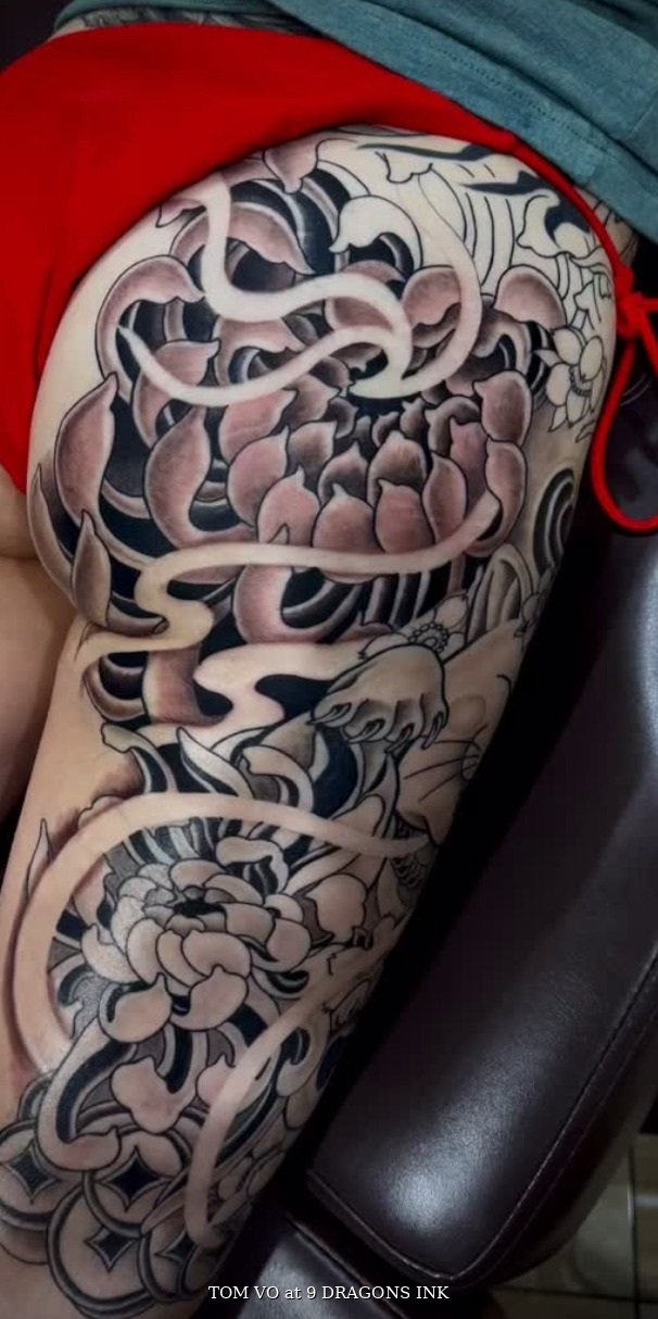 Hip-to-thigh chrysanthemum tattoo by Tom Vo at 9 Dragons Ink in San Jose